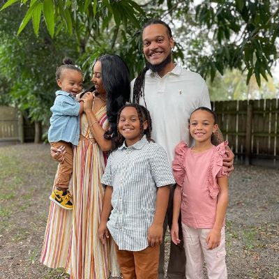 Channing, Channing II, and Ava are looking at the camera as Aja is looking at Chaz Lee.